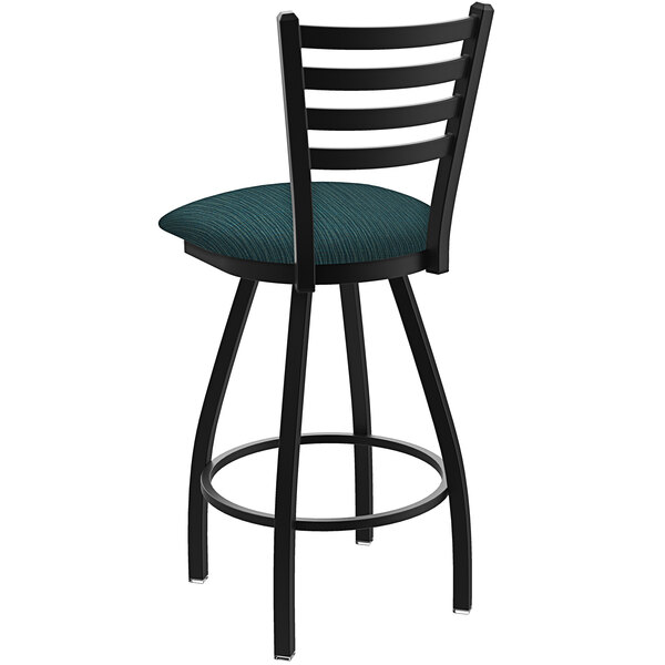 A black Holland Bar Stool XL Jackie Ladderback swivel bar stool with a blue seat.