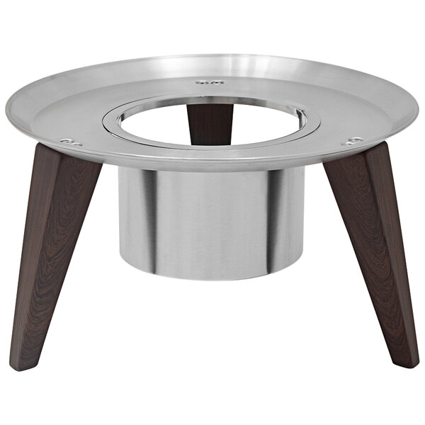 A Spring USA Wynwood round stainless steel and faux wood display stand on a table.