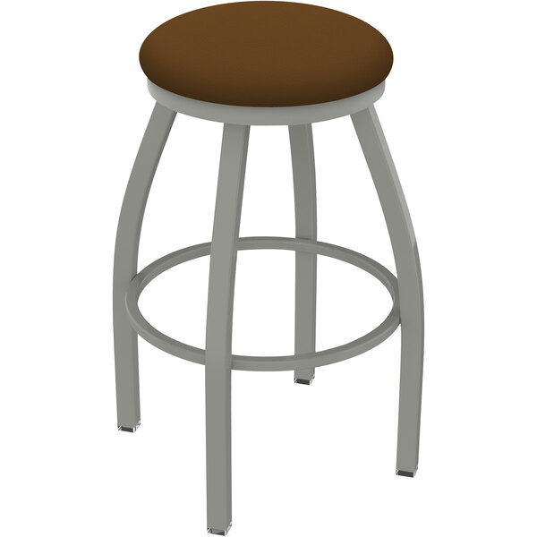 A Holland Bar Stool Misha Ladderback Swivel Bar Stool with a brown seat.
