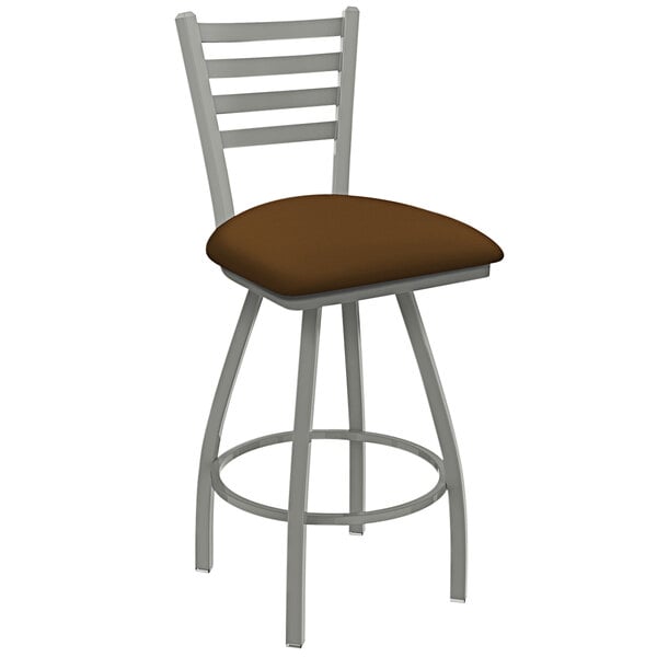 A Holland Bar Stool ladderback swivel counter stool with a brown padded seat and back.