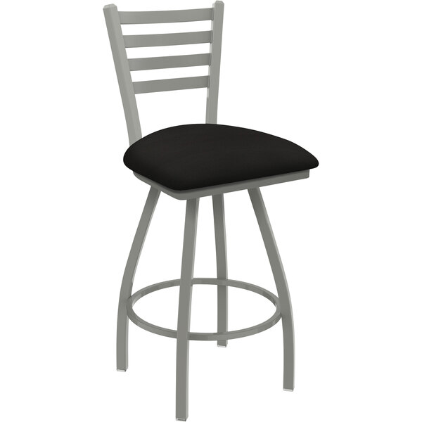 A black Holland Bar Stool Jackie ladderback counter stool with a black cushion.