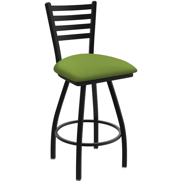 A Holland Bar Stool Jackie Ladderback Swivel Bar Stool with green cushion on black legs.