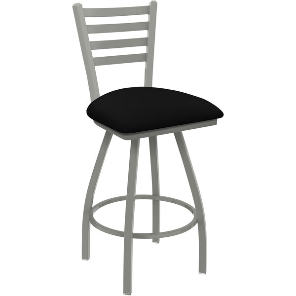 A Holland Bar Stool Jackie Ladderback Swivel Bar Stool with black vinyl seat.