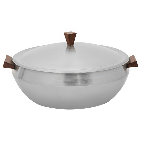 A Spring USA stainless steel induction serving dish with faux wood accents.