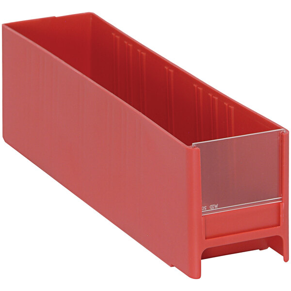 A red rectangular Quantum cabinet drawer with a clear bottom.