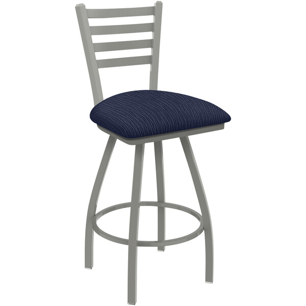 A Holland Bar Stool swivel bar stool with a blue seat and back with a graph anchor design.