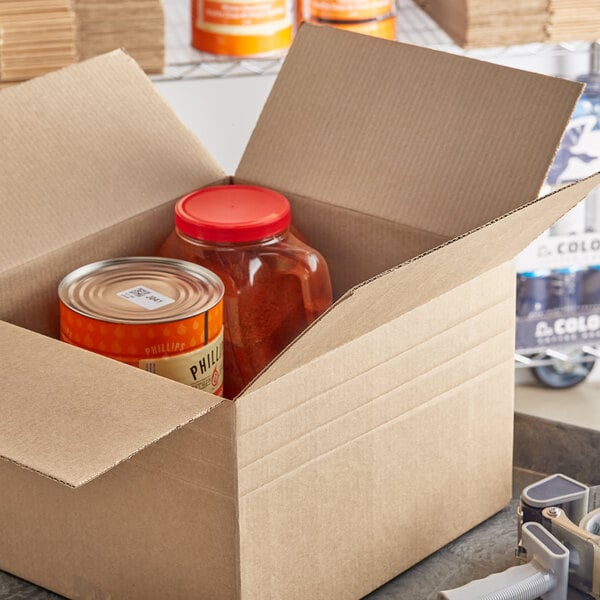 A Lavex cardboard shipping box with a container and can of food inside.