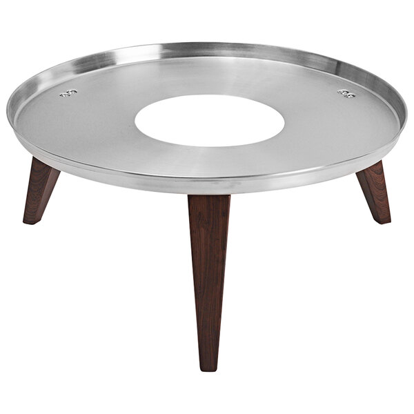 A round stainless steel and faux wood display stand with a hole in the middle.