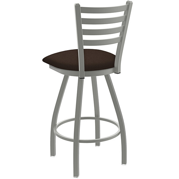 A Holland Bar Stool Jackie ladderback swivel counter stool with brown cushioned seat and anodized nickel finish.