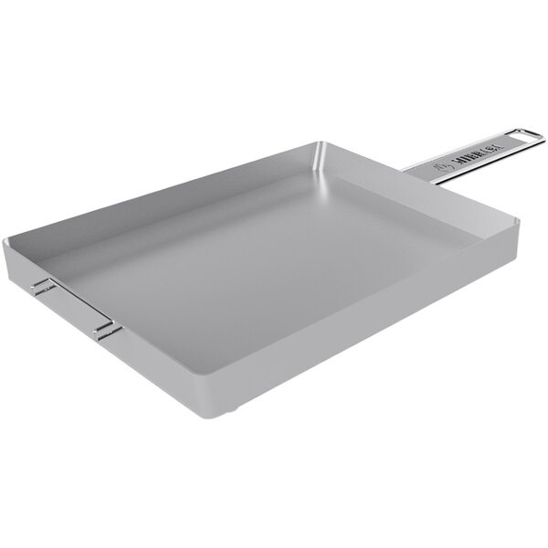 A rectangular stainless steel Mibrasa grill resting tray with a handle.
