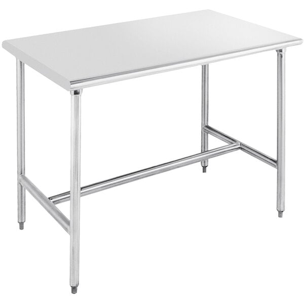 An Advance Tabco stainless steel work table with an open metal base.