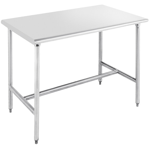 A stainless steel Advance Tabco work table with an open metal base.