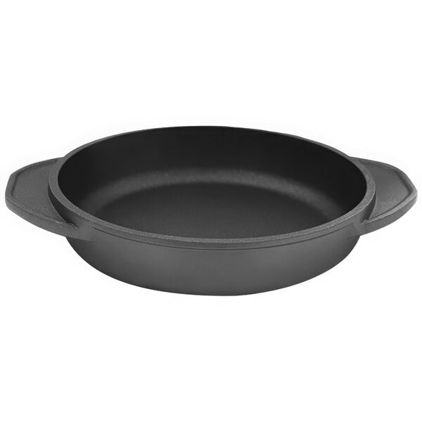 A black round Mibrasa cast aluminum casserole dish with two handles.