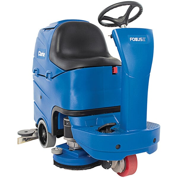 A blue Clarke Focus II 26D MicroRider floor scrubber with wheels.