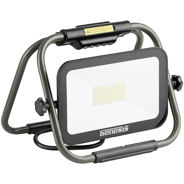 A Genesis foldable LED work light with a black base and a white lamp.