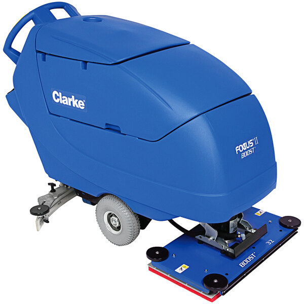 A blue Clarke Focus II BOOST32 walk behind floor scrubber machine with wheels.