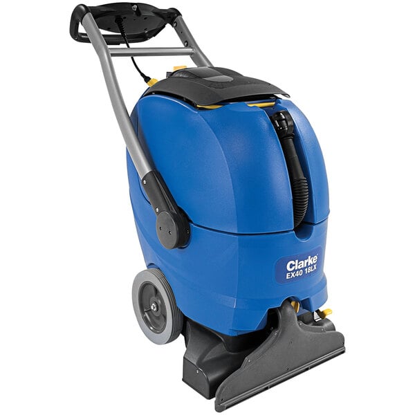 A blue and black Clarke carpet extractor with wheels.