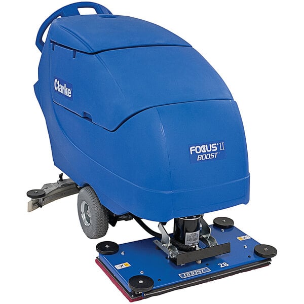 A blue and black Clarke Focus II walk behind floor scrubber with wheels.