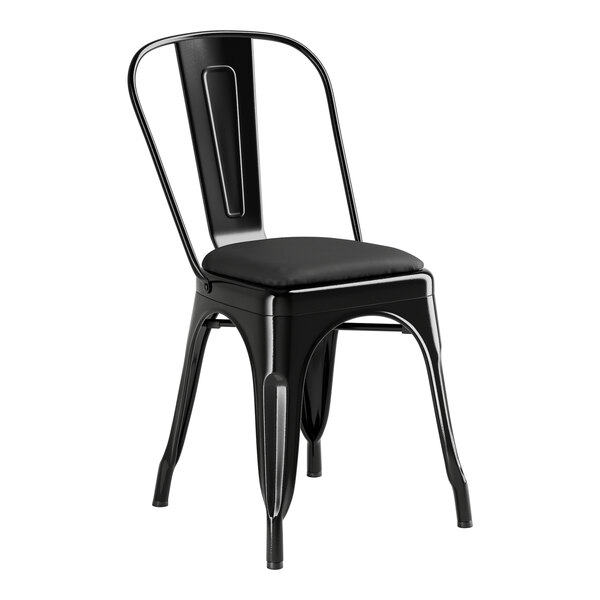 A Lancaster Table & Seating black metal cafe chair with black cushion.