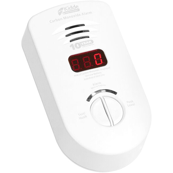 A white Kidde carbon monoxide alarm with a red digital display and numbers.