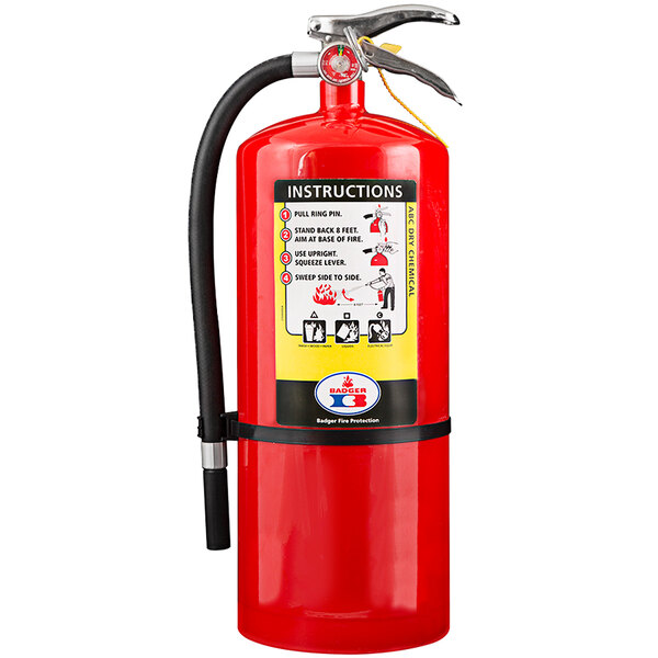 A red Badger fire extinguisher with a black hose and Spanish instructions.