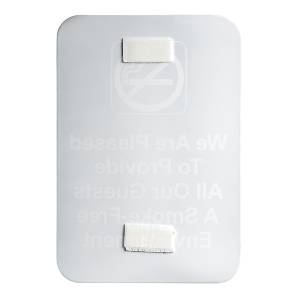 A white rectangular sign with black text that says "We are pleased to provide all our guests" on a white surface.