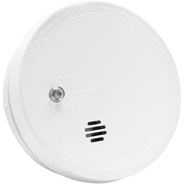 A white Kidde smoke alarm with a black button.