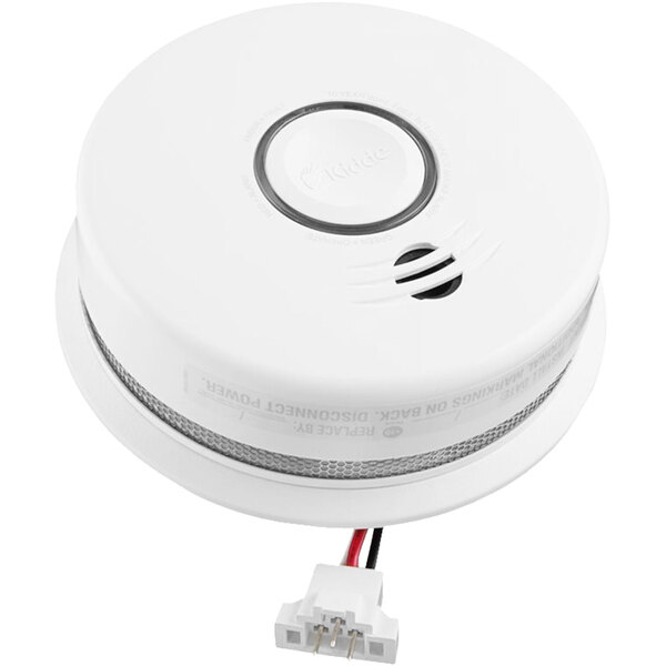 A Kidde hardwired smoke detector with a white cover and wires.