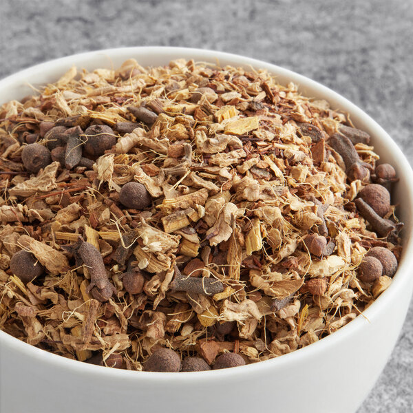 A bowl of Davidson's Organic Pumpkin Spice Herbal Loose Leaf Tea leaves.