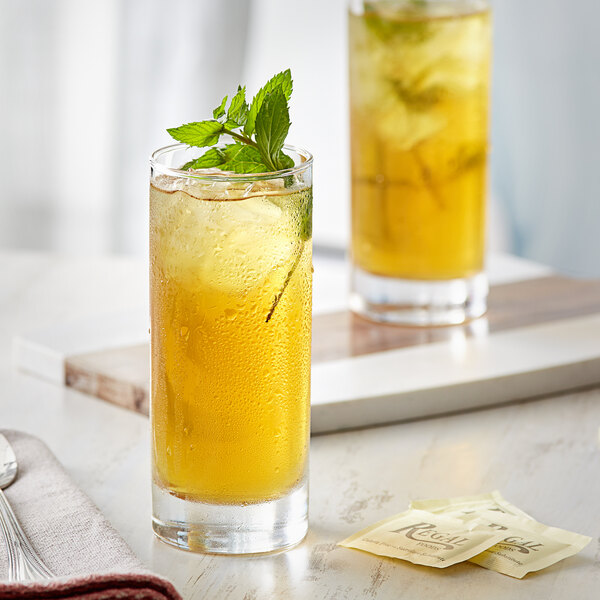 Two glasses of Davidson's Organic Moroccan Mint iced tea with lemon and mint leaves.