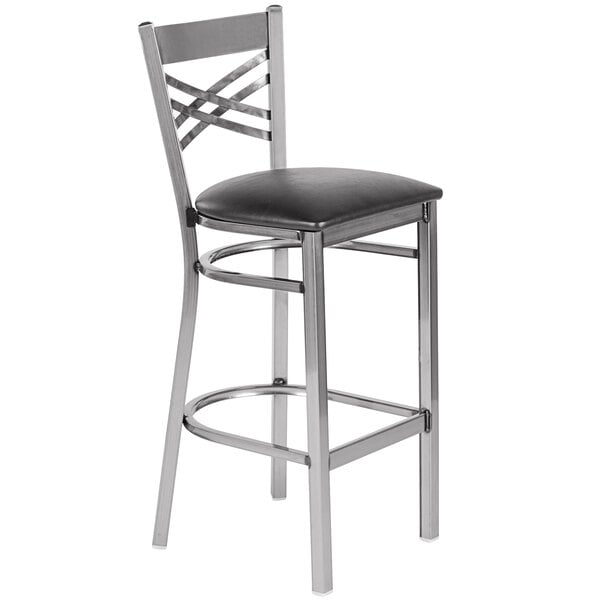 A Lancaster Table & Seating black vinyl chair with a black cushion.