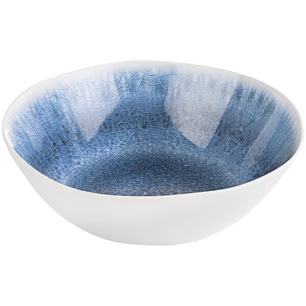 A blue melamine bowl with a crackle pattern and white rim.