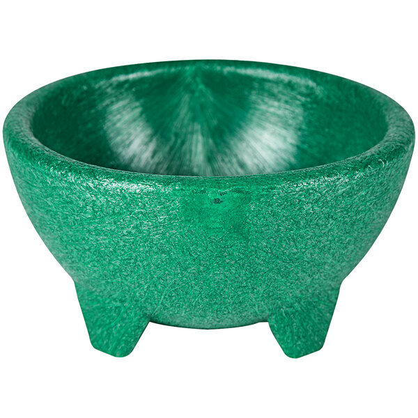 A green polypropylene molcajete with three legs.