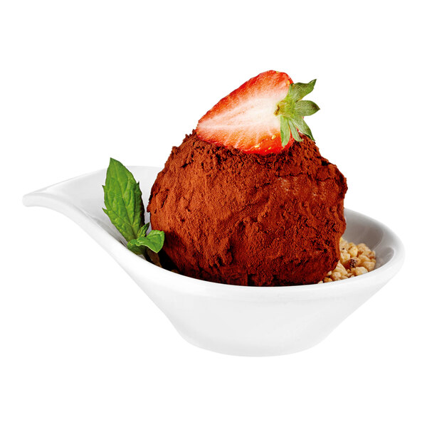 A small white melamine bowl containing a chocolate-coated dessert topped with a strawberry slice and garnished with a mint leaf.