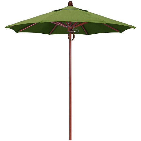 A green umbrella with a wooden pole.