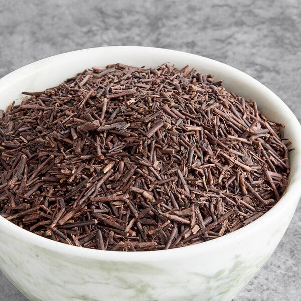 A bowl of Davidson's Organic Kukicha loose leaf tea sticks.