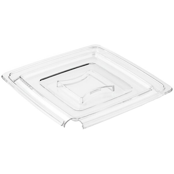 A clear square plastic lid with a spoon holder.