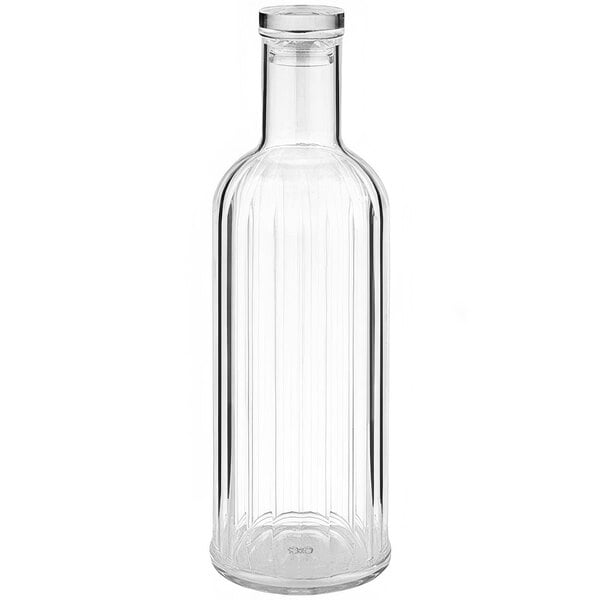 A clear ribbed plastic bottle with a lid on a white background.