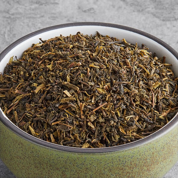 A bowl of Davidson's Organic Imperial Green loose leaf tea.