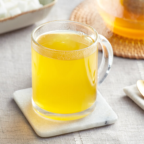 A glass mug of Davidson's Organic De-Congest Herbal loose leaf tea.