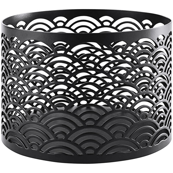 A black stainless steel circular basket with a pattern on a buffet stand.