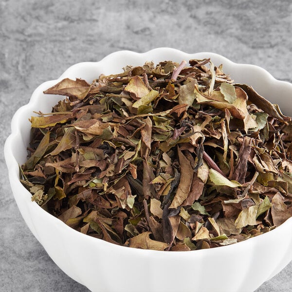 A bowl of Davidson's Organic White Peony Loose Leaf Tea.