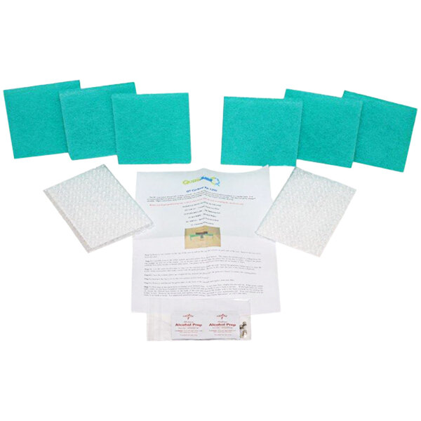 A white rectangular paper with blue and green squares and rectangles.