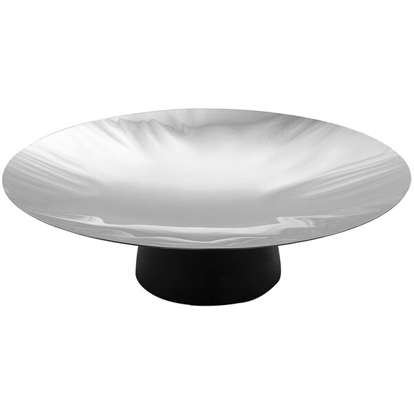 A stainless steel round platter with a black base.