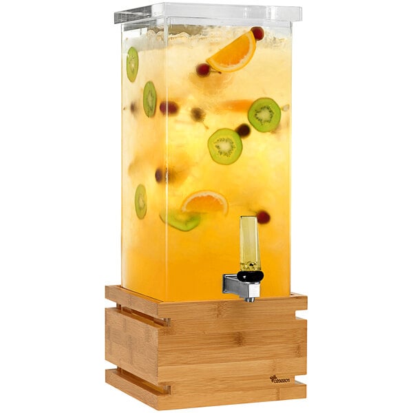 A Rosseto clear acrylic beverage dispenser with fruit in it.