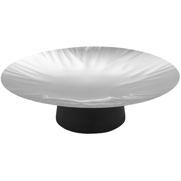 A stainless steel round platter with a black base.