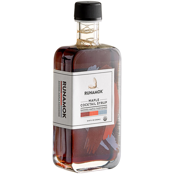 A bottle of Runamok Smoked Maple Old Fashioned cocktail syrup with a white label.