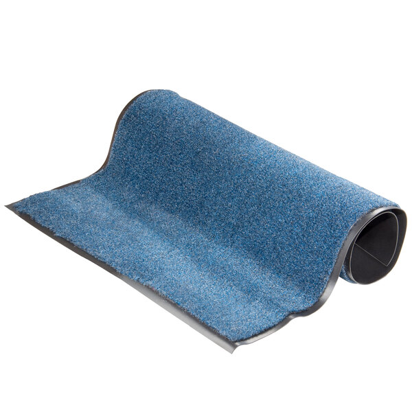 A roll of blue carpet with black trim.