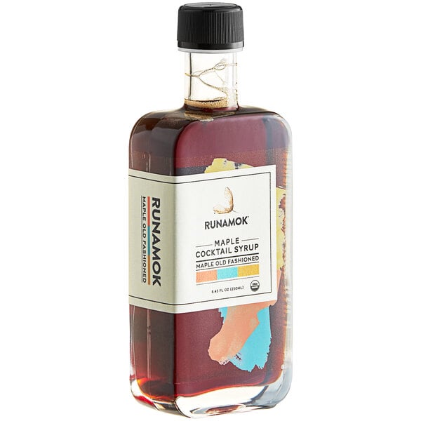 A bottle of Runamok Maple Old Fashioned Cocktail Syrup with a white label.