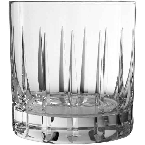 A clear Schott Zwiesel double old fashioned glass with a straight edge and patterned design.